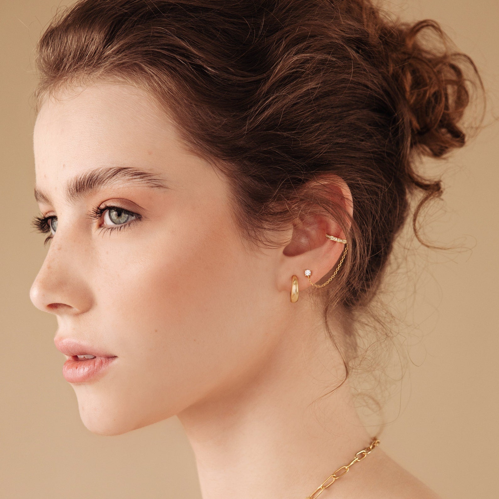 Ivy clip-on earrings with a sparkly chain.