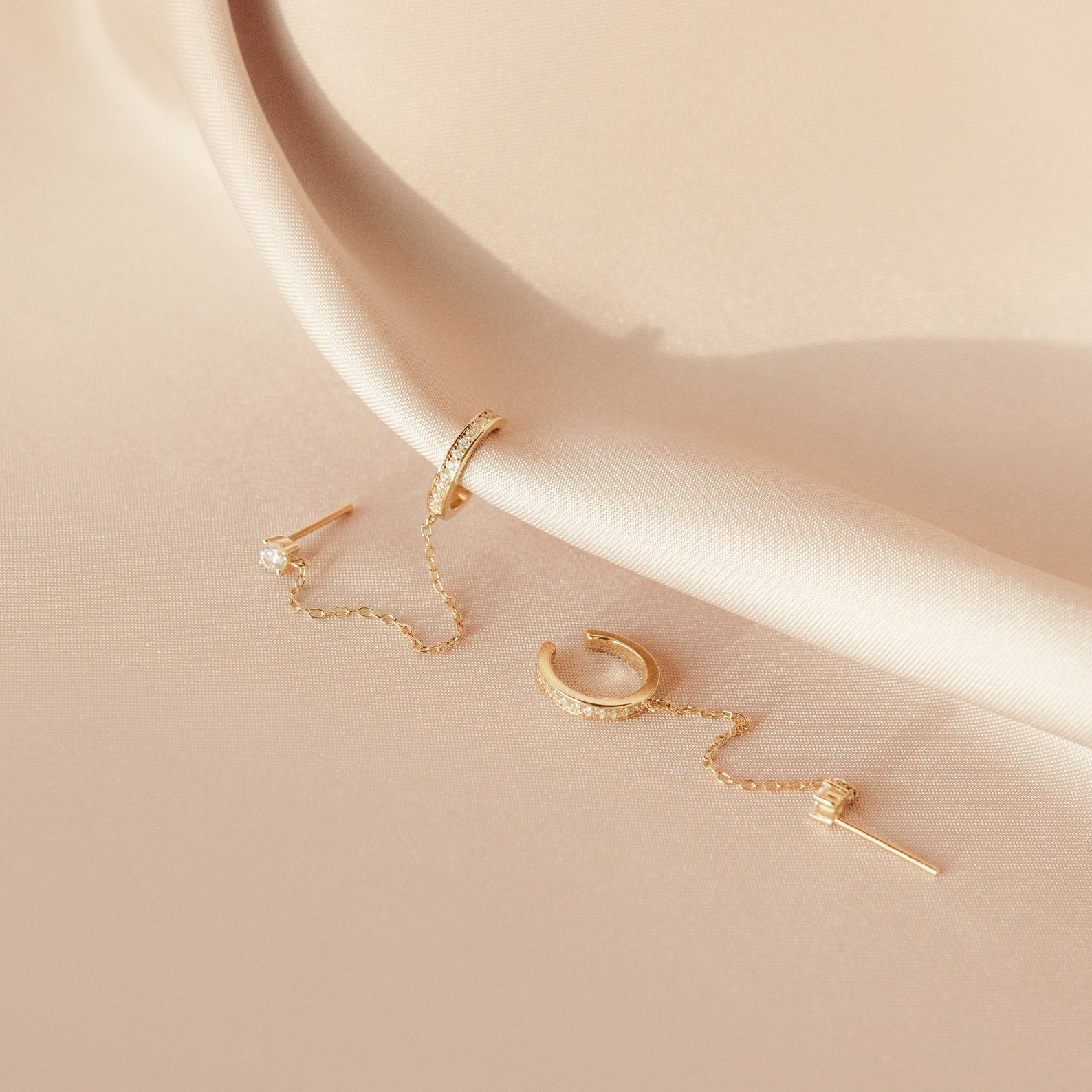 Ivy clip-on earrings with a sparkly chain.