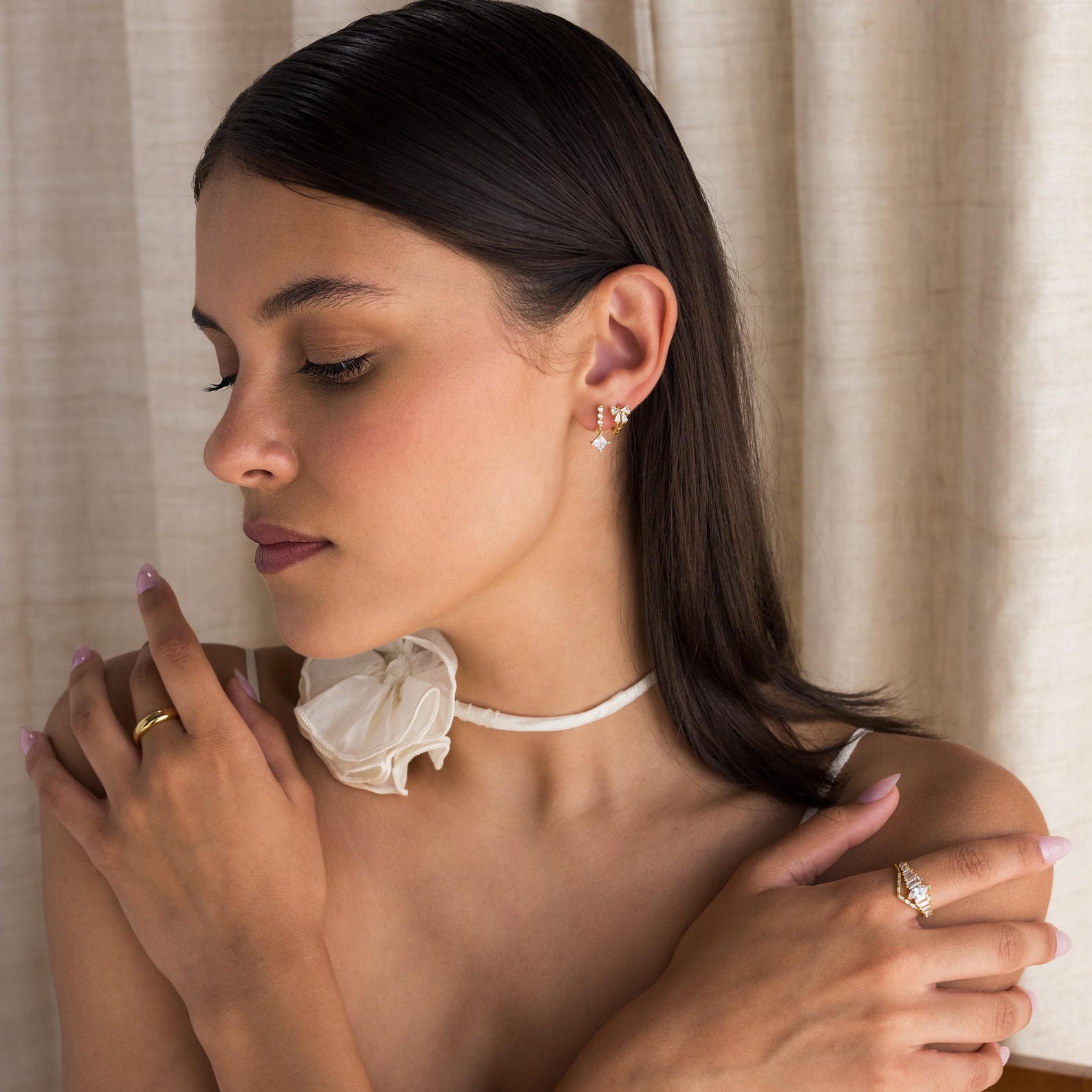 Little hoop earrings with a sparkly bow.