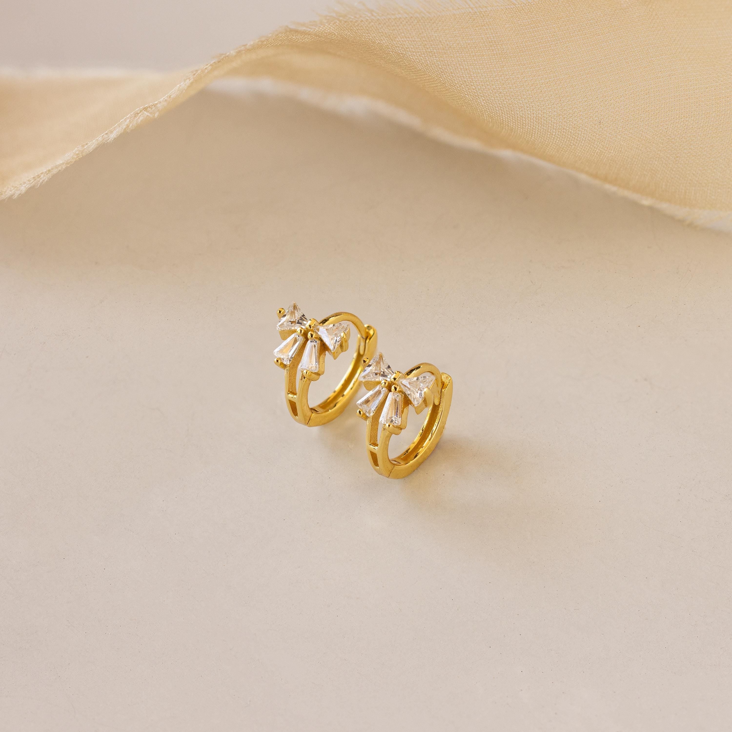 Little hoop earrings with a sparkly bow.