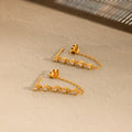 Zara earrings with chain in 18k gold.